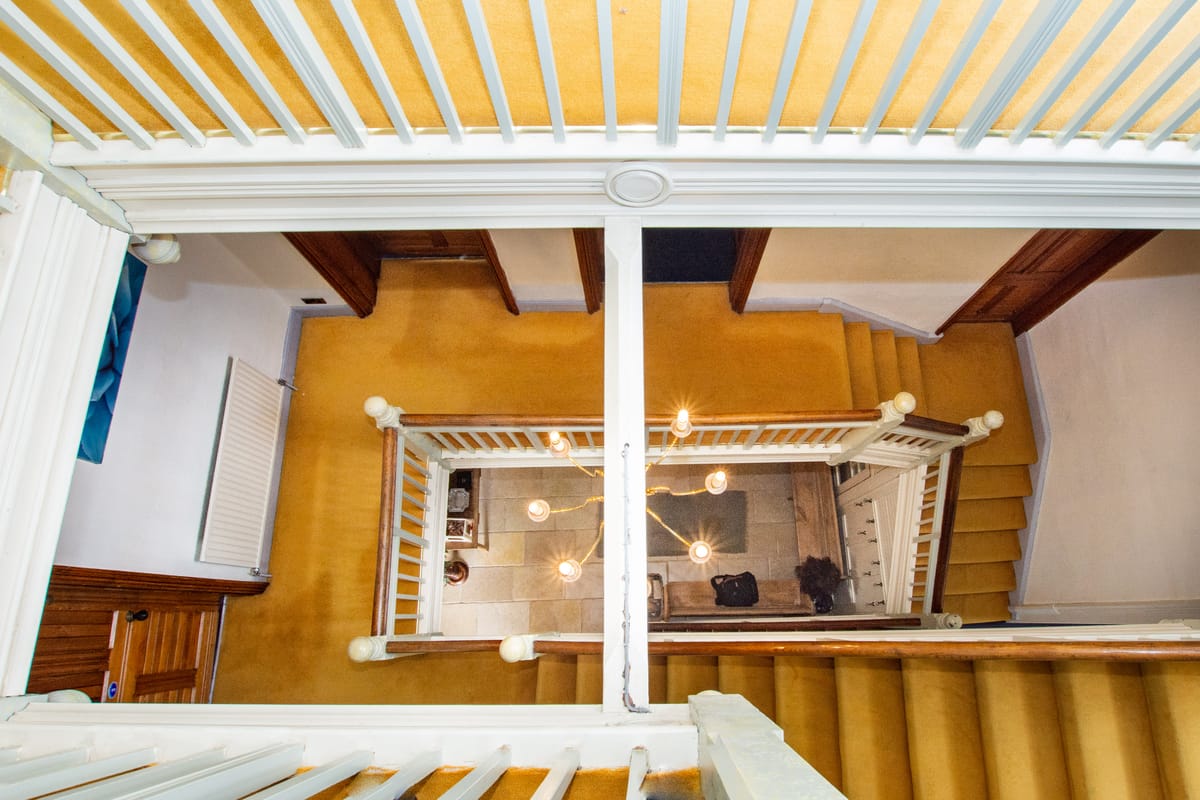 View of the square spiral staircase from above Fairlea Grange sleeps 24 self catering accommodation Abergavenny Monmouthshire Wales www.bhhl.co.uk